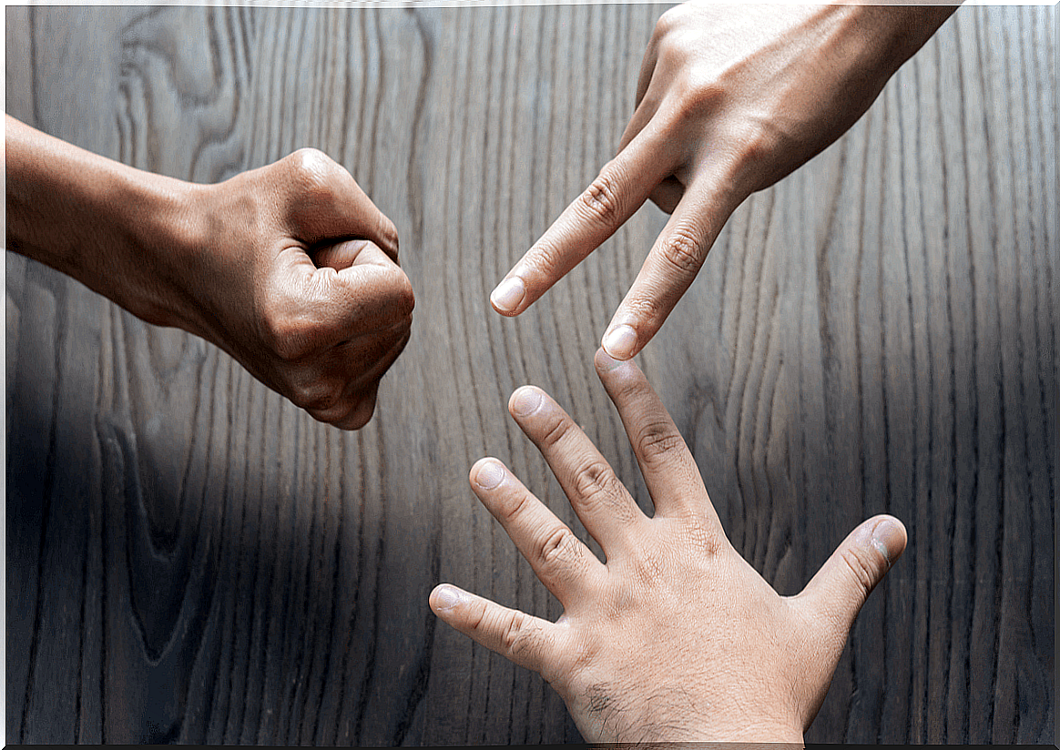 Hands of people playing rock-paper-scissors