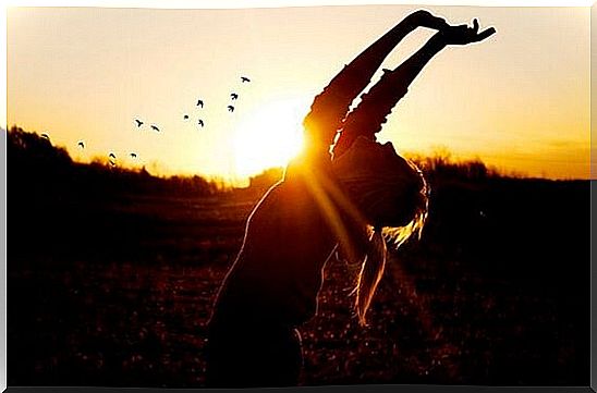 woman with outstretched arms trying to get through a bad day