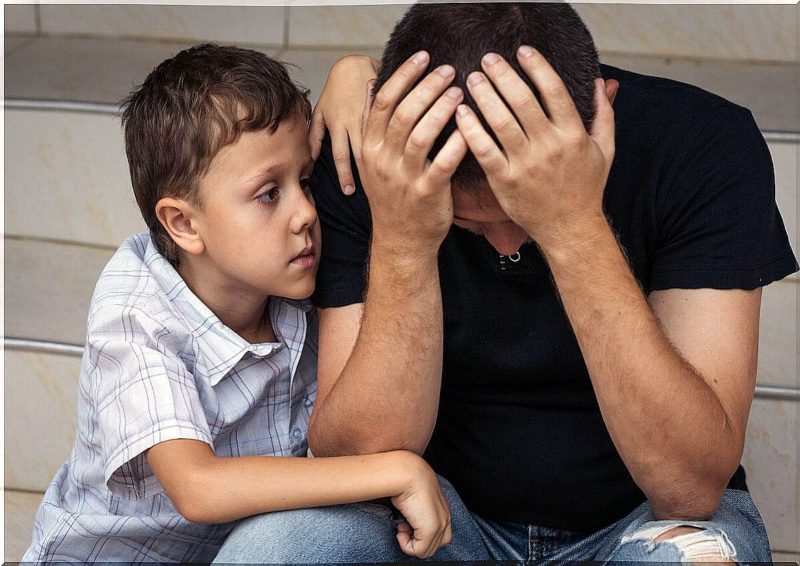 Sad father with his little son symbolizing the pain of feeling guilty after a mistake