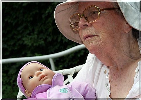 Elderly person with a doll