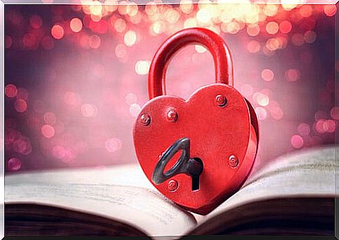 Heart with a lock and a key on a book