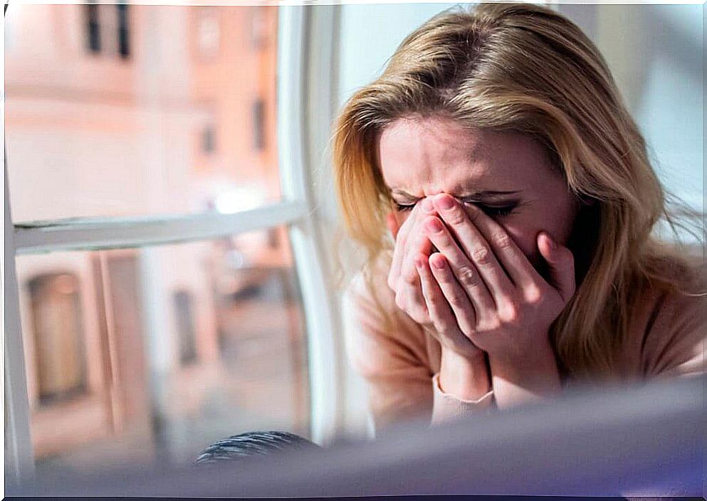 Crying woman thinking about how to communicate bad news