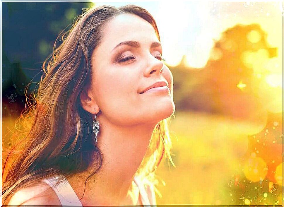 Woman with positive thoughts smiling enjoying the moment of happiness