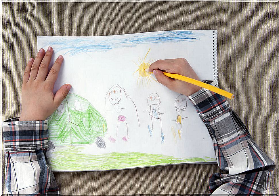 Child drawing a family