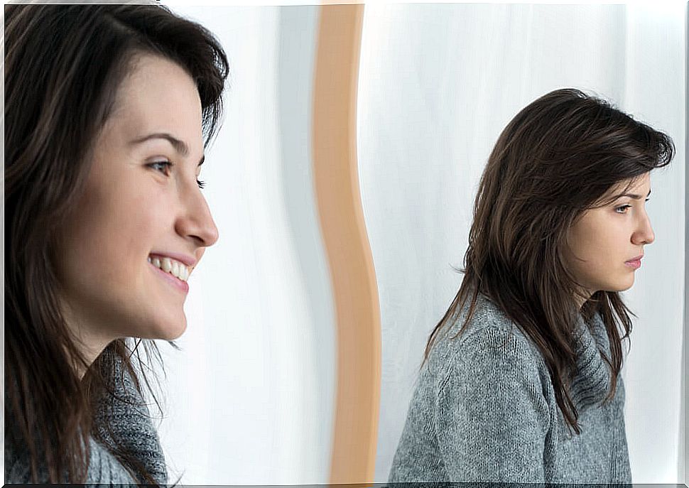 Woman reflected in the sad mirror