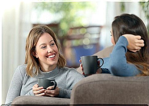 Girlfriends talking while having coffee