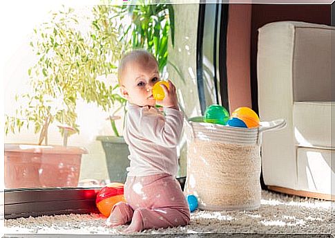 Baby playing with balls