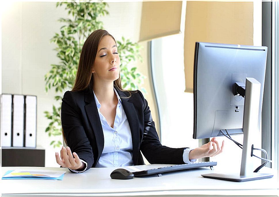 Woman breathing at her workplace