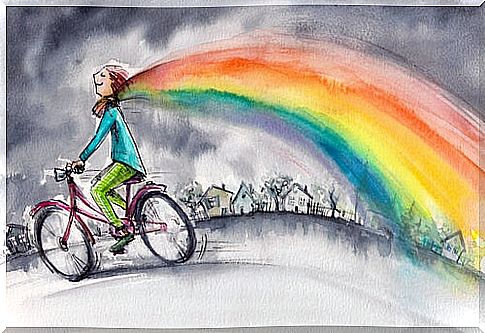 Happy woman with a rainbow