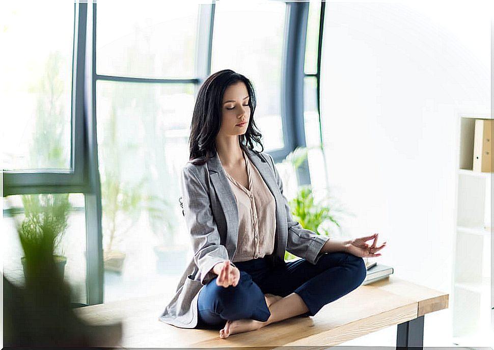 Woman meditating at work