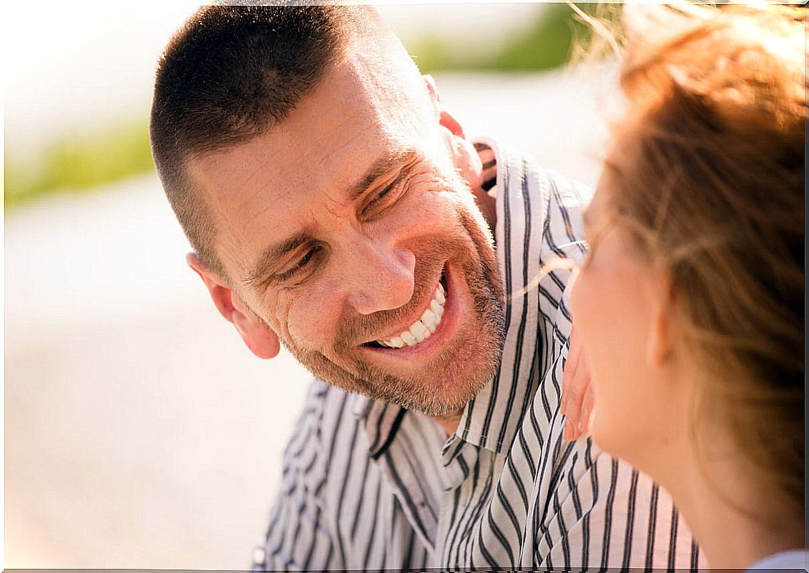 Man smiling at a woman