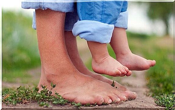 feet of dad and his baby working secure attachment