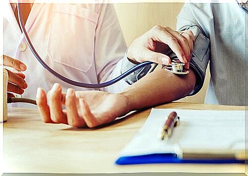 Doctor taking blood pressure to his patient