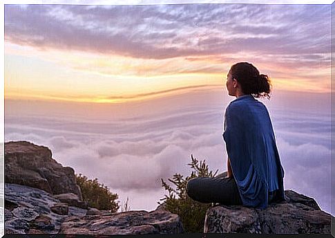 Woman on top of a mountain