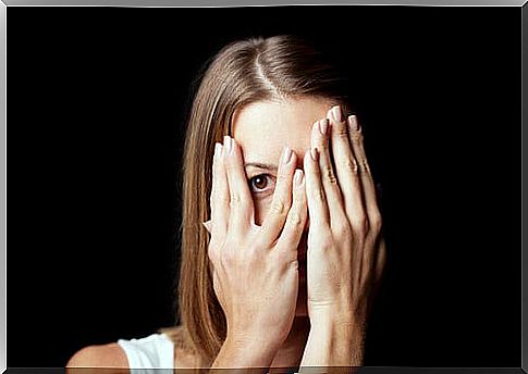 Woman covering her face