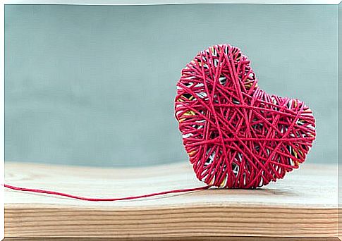 Heart made of red yarn