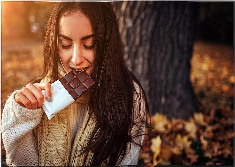 Woman eating chocolate