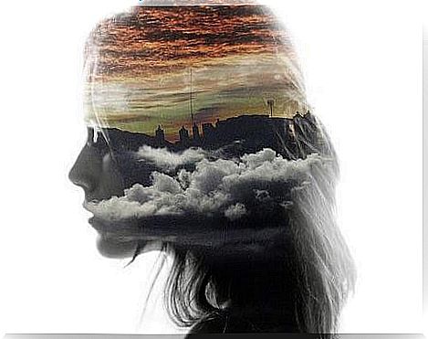 profile of a woman with clouds in the center