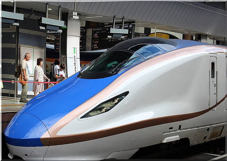 Bullet train in Tokyo station to represent the Shinkansen effect