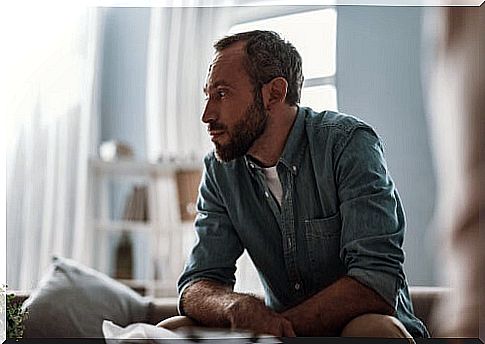 Worried man feeling lonely at home