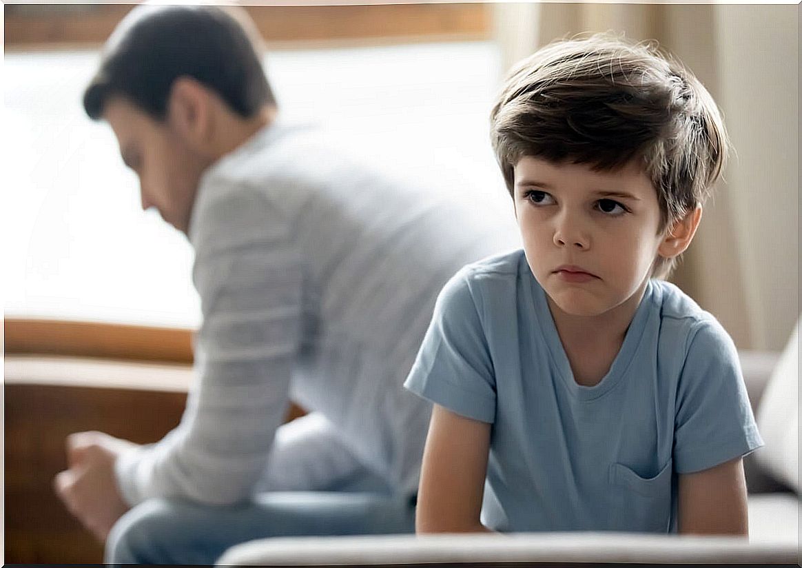 Boy ignoring his father