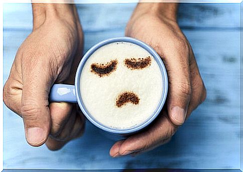 Mug with a drawing of a sad face