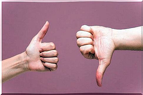 Hands with thumb up and down